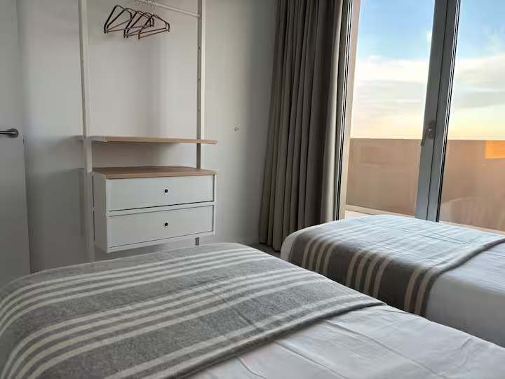 Twin bedroom with wardrobe storage